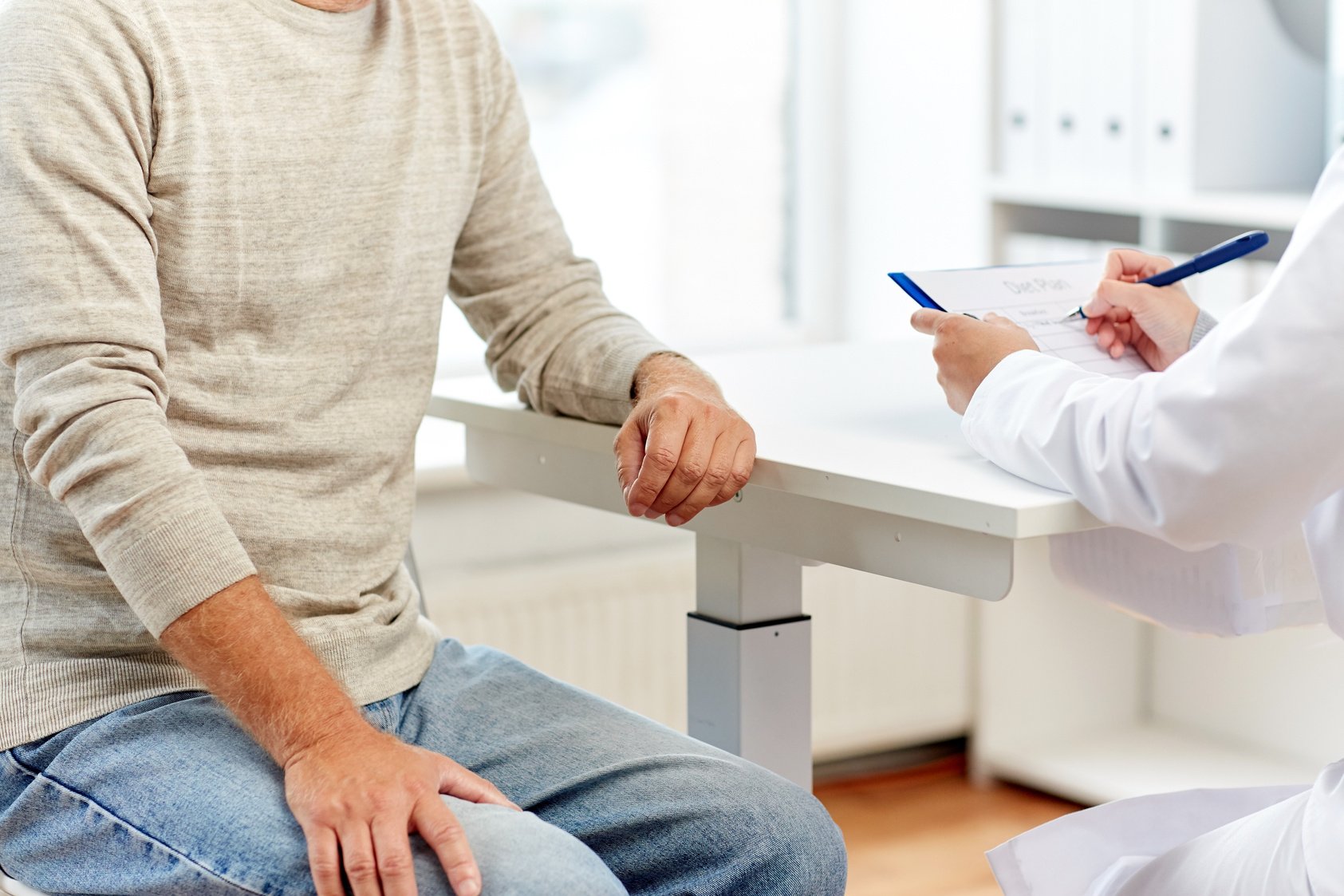 Senior Man and Doctor at Hospital